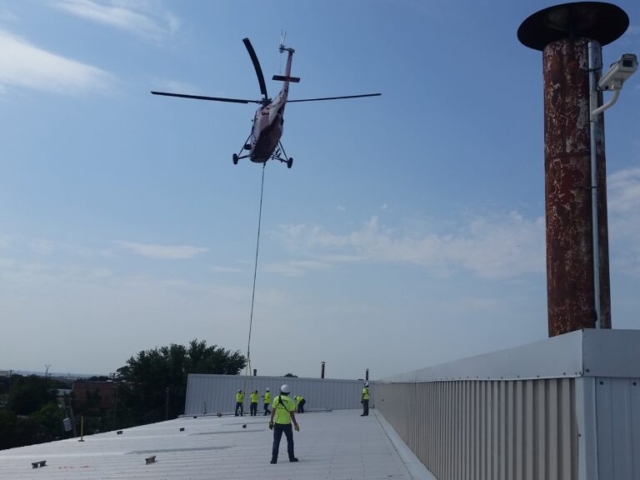 photo of Helicopter Bringing In Reroof Materials