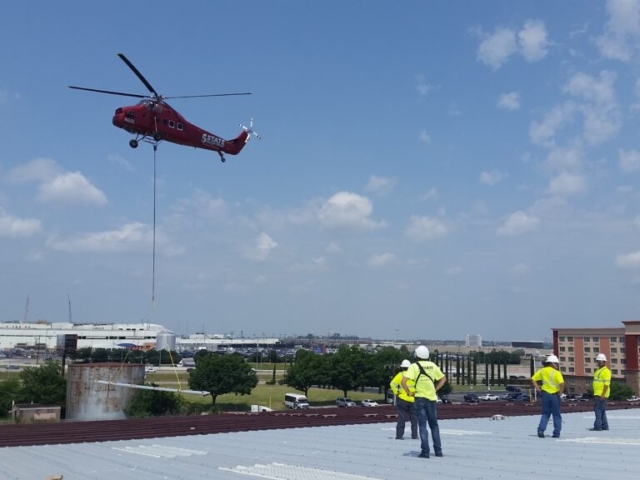 photo of Helicopter Bringing In Reroof Materials