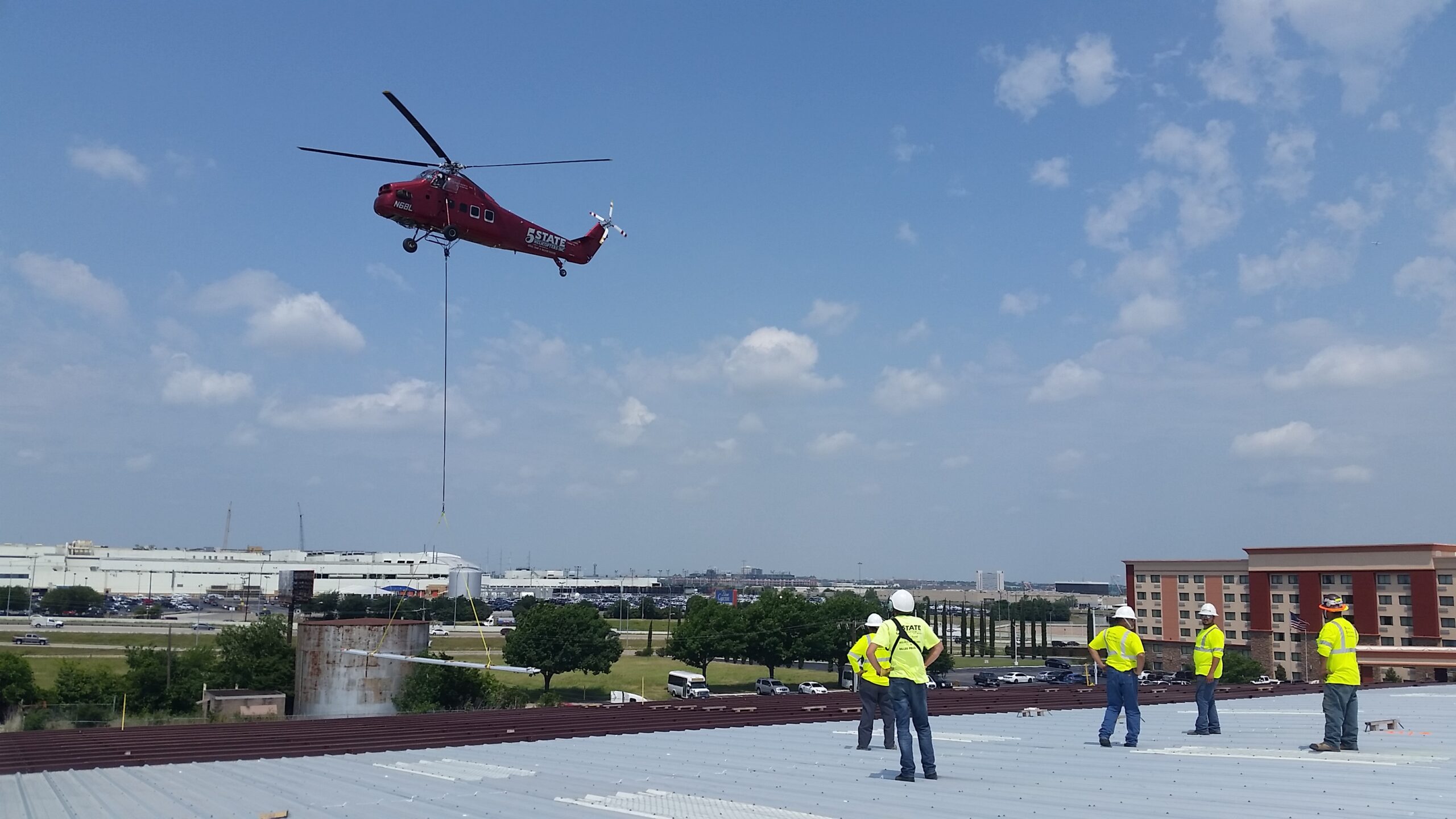 photo of Helicopter Bringing In Reroof Materials