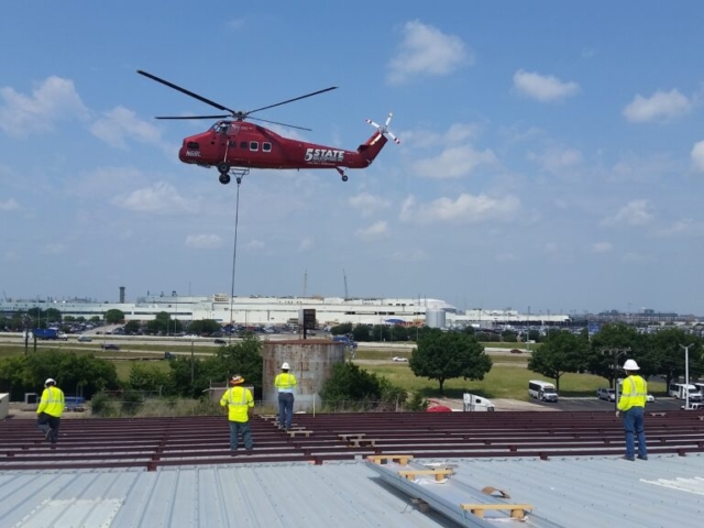 photo of Helicopter Bringing In Reroof Materials